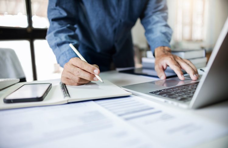 Close-up,Shot,,Asian,Businessman,Take,A,Note,And,Working,With