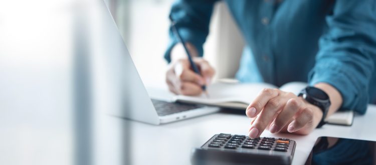 Doing,Finance,,Budgeting,And,Tax,Calculation.,Close,Up,Woman,Hand