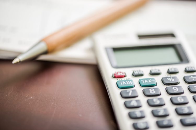 Taxation,And,Accounting,Concept,With,Pen,And,Calculator