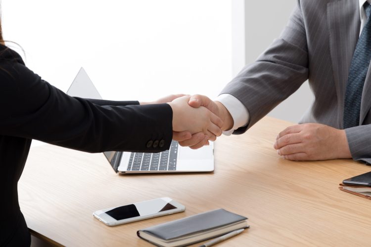 Businesswoman,And,Businessman,Shaking,Hands,,Concluding,,Contracting,